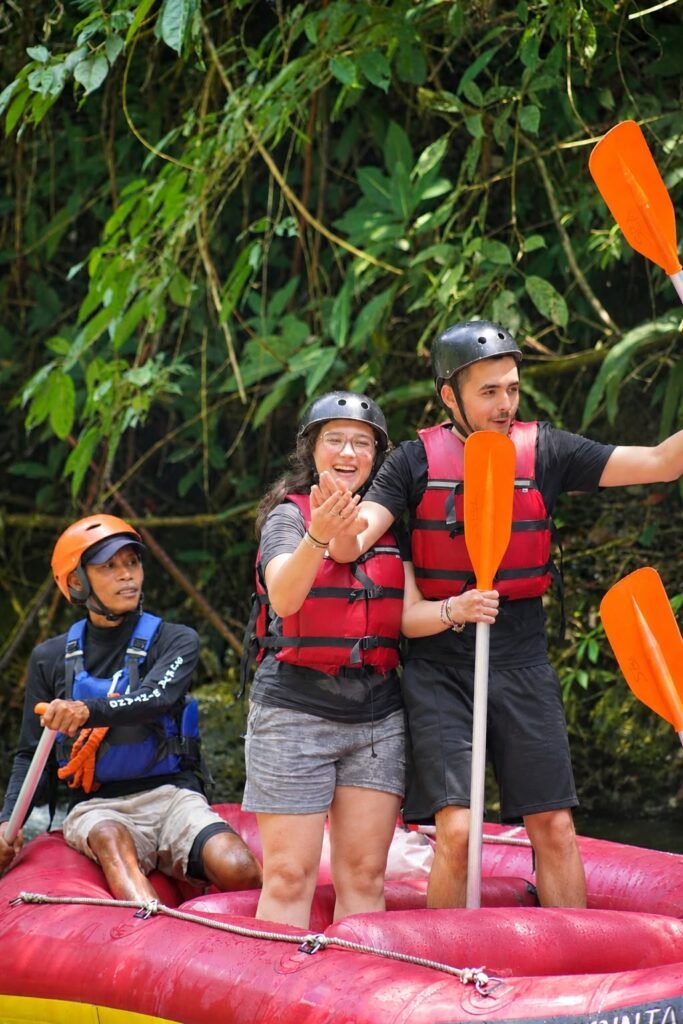 Guests enjoying white water rafting on a river in Ubud, Bali